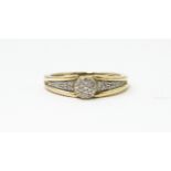 A 9ct gold ring set with diamonds. Ring size approx. M 1/2 Please Note - we do not make reference to