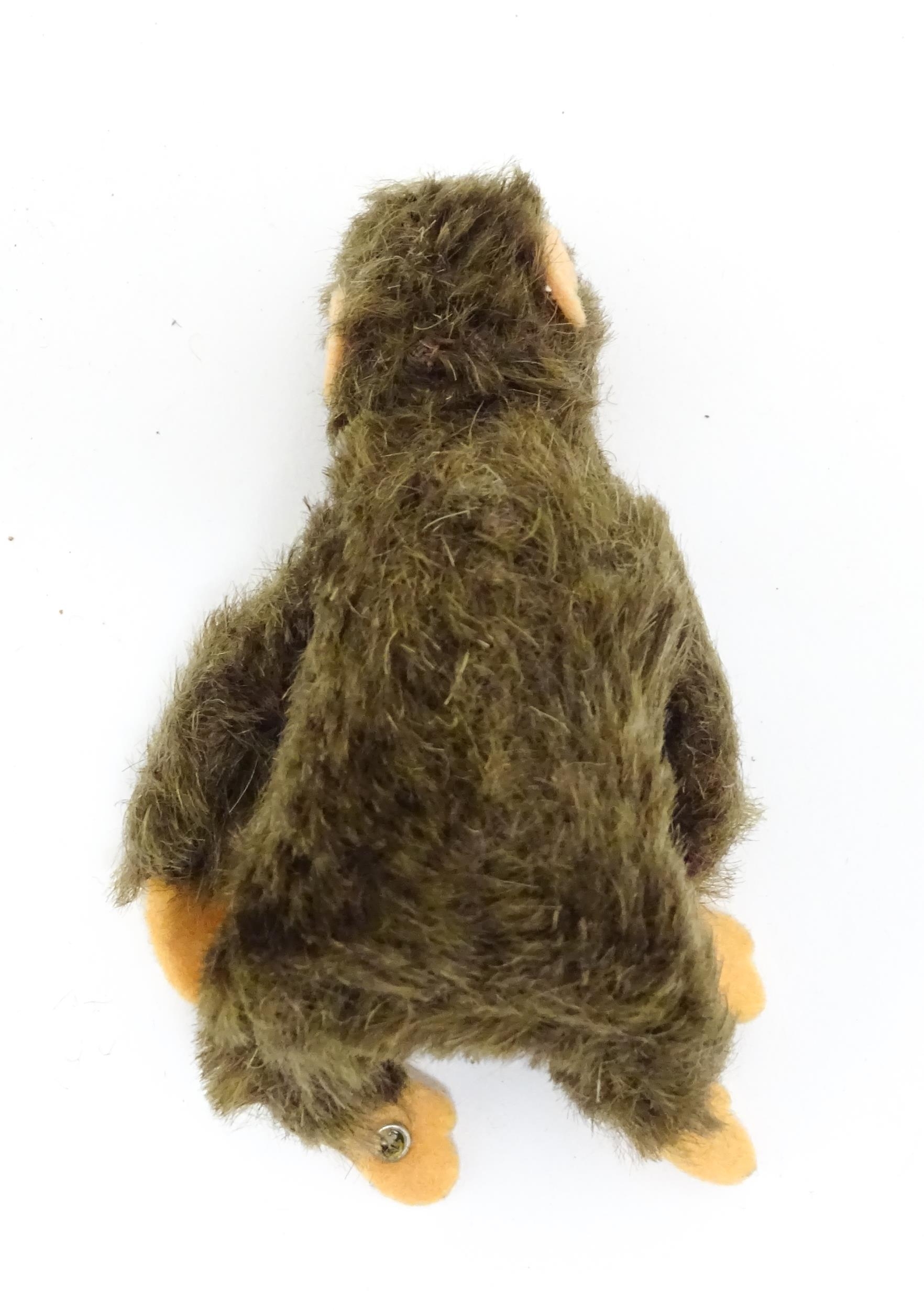 Toy: A small 20thC Steiff mohair soft toy modelled as a monkey / chimpanzee, with felt face, ears - Bild 9 aus 9