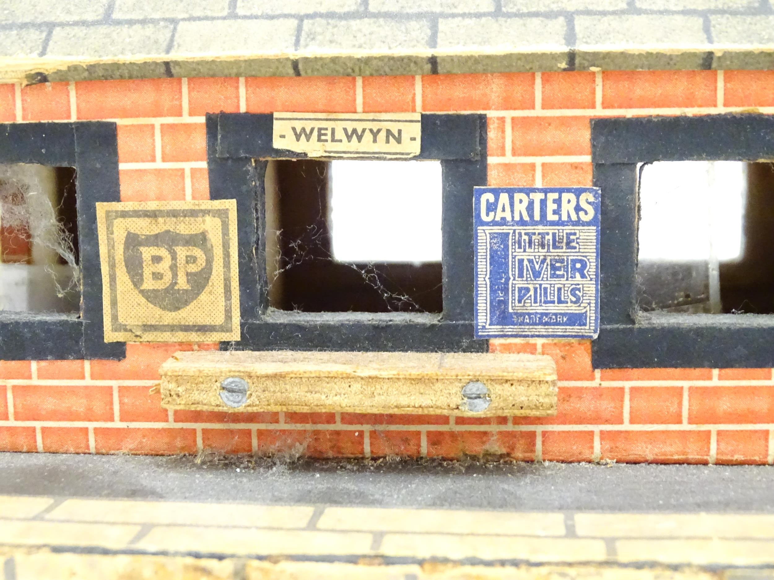 Toys: A 20thC scratch built wooden model railway station / platform with various adverts for - Bild 4 aus 10