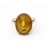 A 9ct gold ring set with oval citrine. Ring size approx. P Please Note - we do not make reference to
