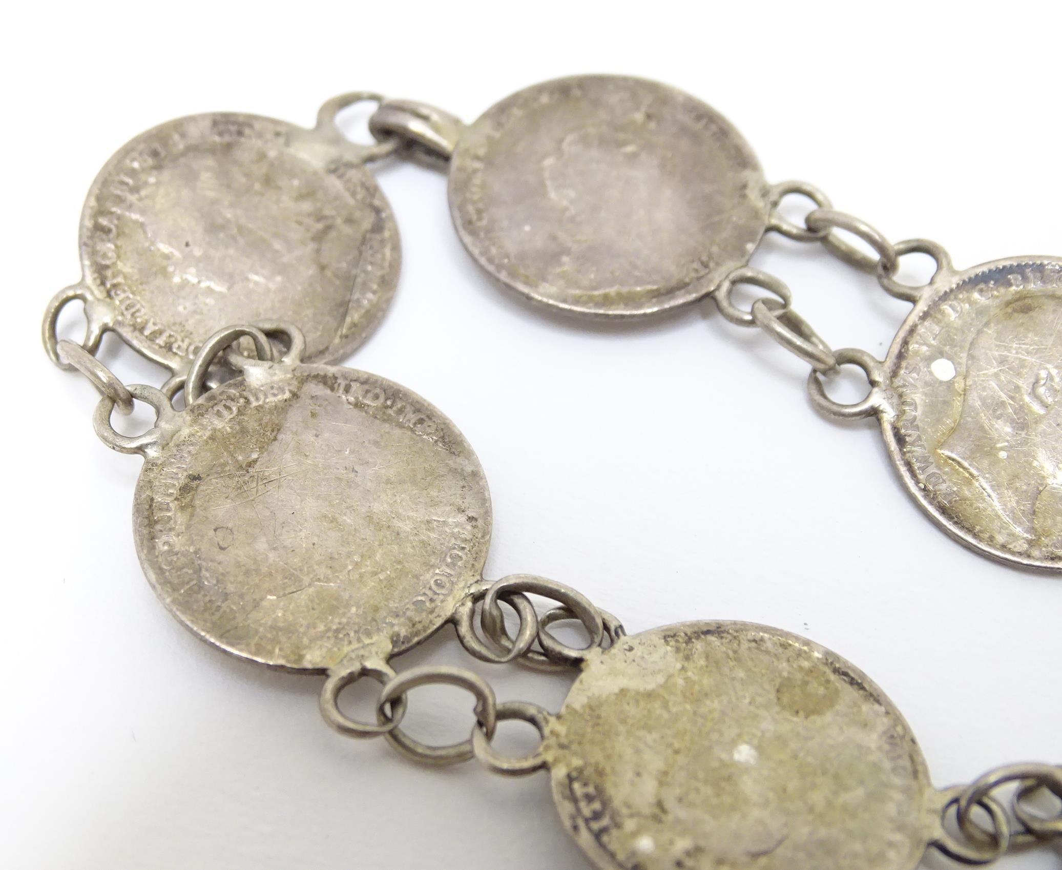 A silver and white metal bracelet set with Victorian and later 3 pence coins. Together with a silver - Image 4 of 7