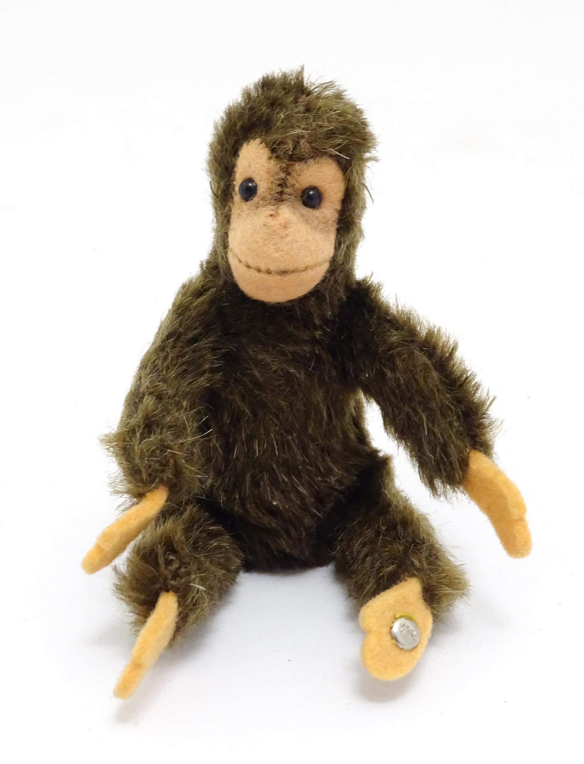 Toy: A small 20thC Steiff mohair soft toy modelled as a monkey / chimpanzee, with felt face, ears - Bild 2 aus 9