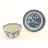 A Chinese blue and white bowl of octagonal form decorated with figures and vases of flowers in