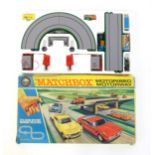 Toy: A boxed mid 20thC Lesney Matchbox M-2 Motorised Motorway set, containing boxed and loose