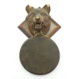 A 20thC Continental gong hanging from a carved wooden fox head mount. Approx. 13 1/2" long Please