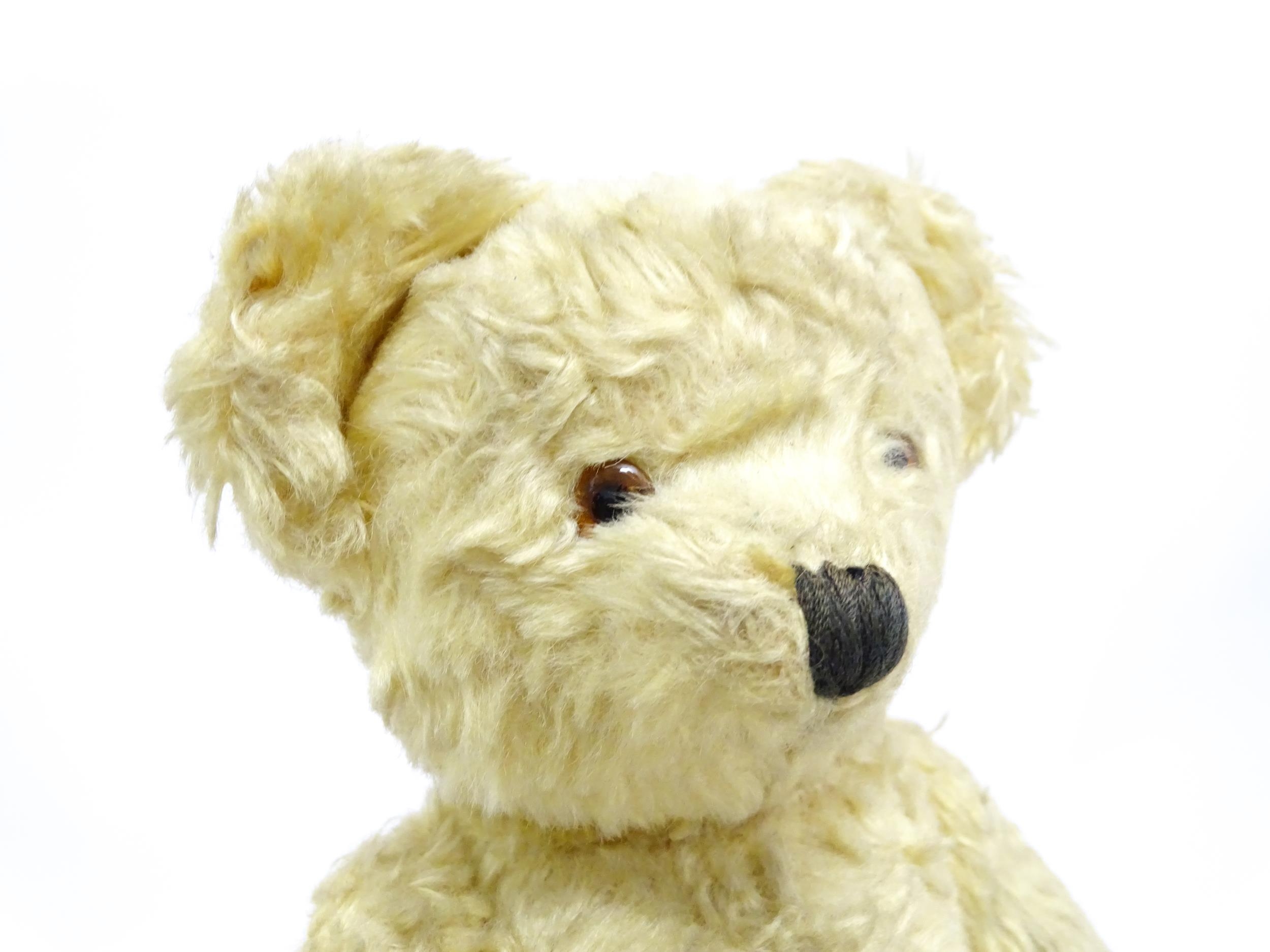 Toy: A 20thC straw filled teddy bear with stitched nose, mouth, and claws, pad paws and - Bild 5 aus 9