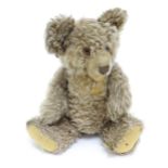 Toy: A 20thC Steiff straw filled mohair teddy bear - Zotty, with stitched nose, open mouth,