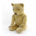 Toy: A 20thC mohair teddy bear with stitched nose, mouth and paws. Approx. 19 1/2" long Please