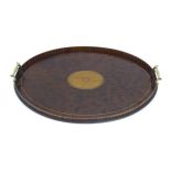 A 19thC mahogany tray of oval form with satinwood inlay and brass handles. Approx. 15 3/4" x 23 1/2"