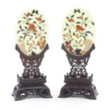 A pair of Chinese hardstone table screens with applied carved hardstone decoration depicting