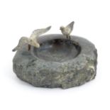 A 20thC serpentine pin dish decorated with two cast and painted models of birds / seagulls to rim.