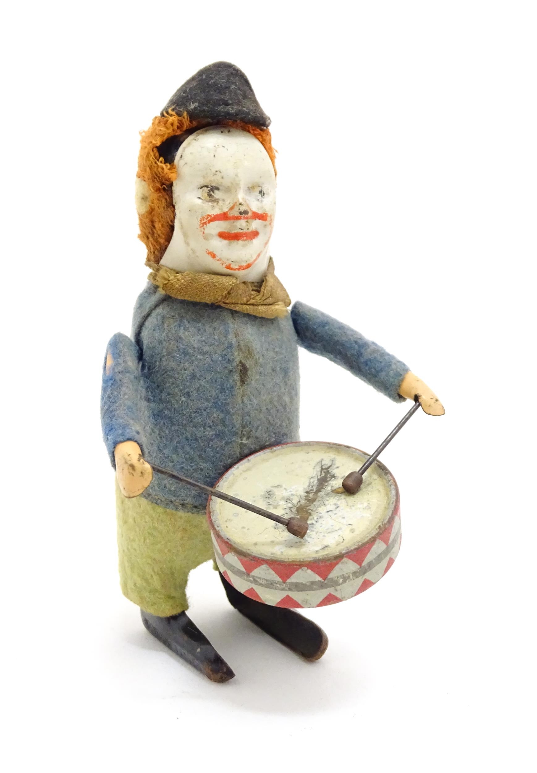 Toys: Three 20thC clockwork / wind up toys comprising a Schuco model of a clown playing the drum, - Bild 5 aus 10