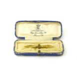 An 18ct enamelled RAF Sweetheart brooch, by page of Plymouth 2" long. Original case Please Note - we