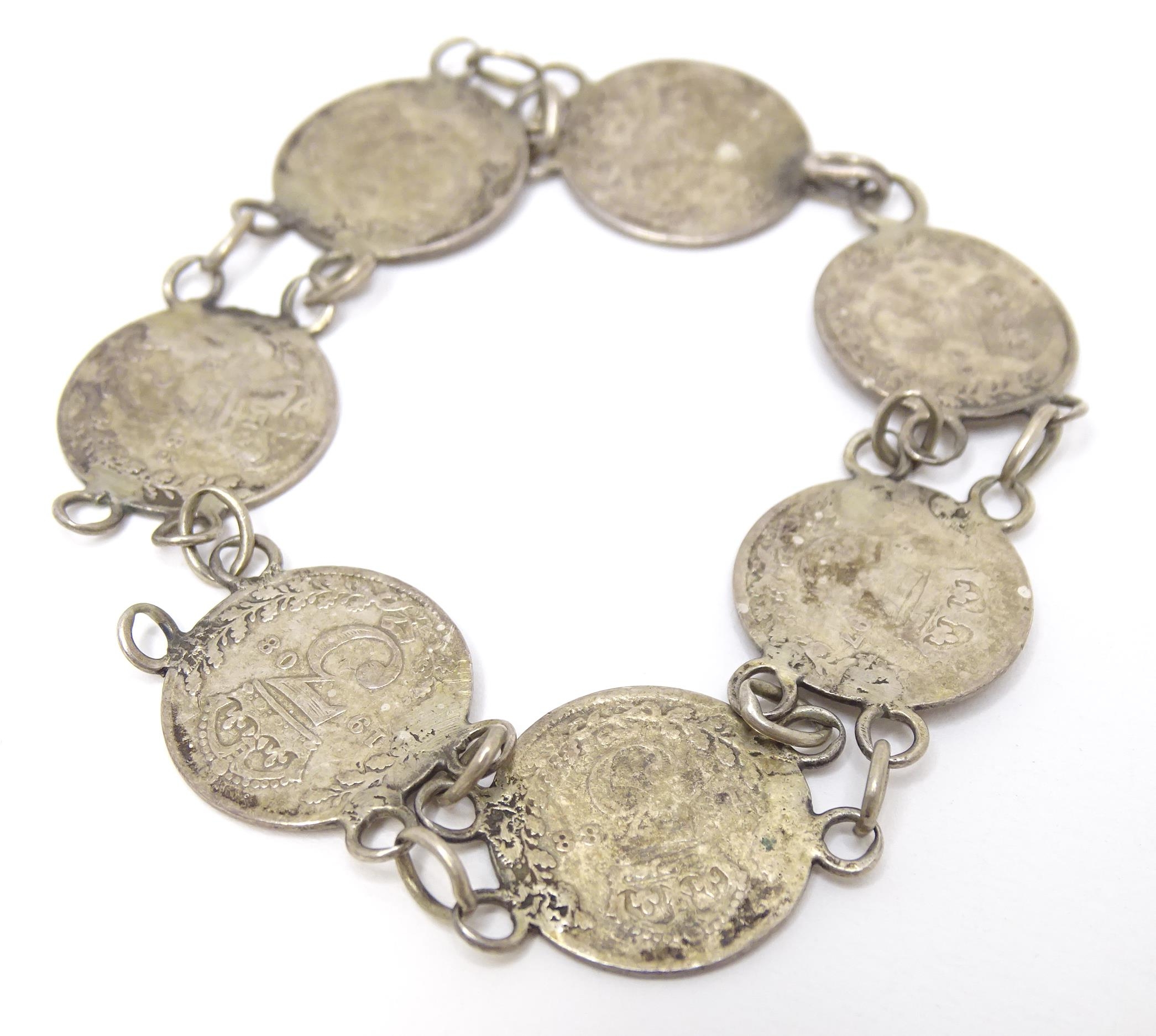 A silver and white metal bracelet set with Victorian and later 3 pence coins. Together with a silver - Image 5 of 7