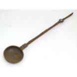 A blacksmith made wrought ladle / long handled spoon with incised and punch detail. Approx 35"