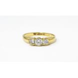 A 9ct gold ring set with a trio cubic zirconia. Ring size approx. N 1/2 Please Note - we do not make