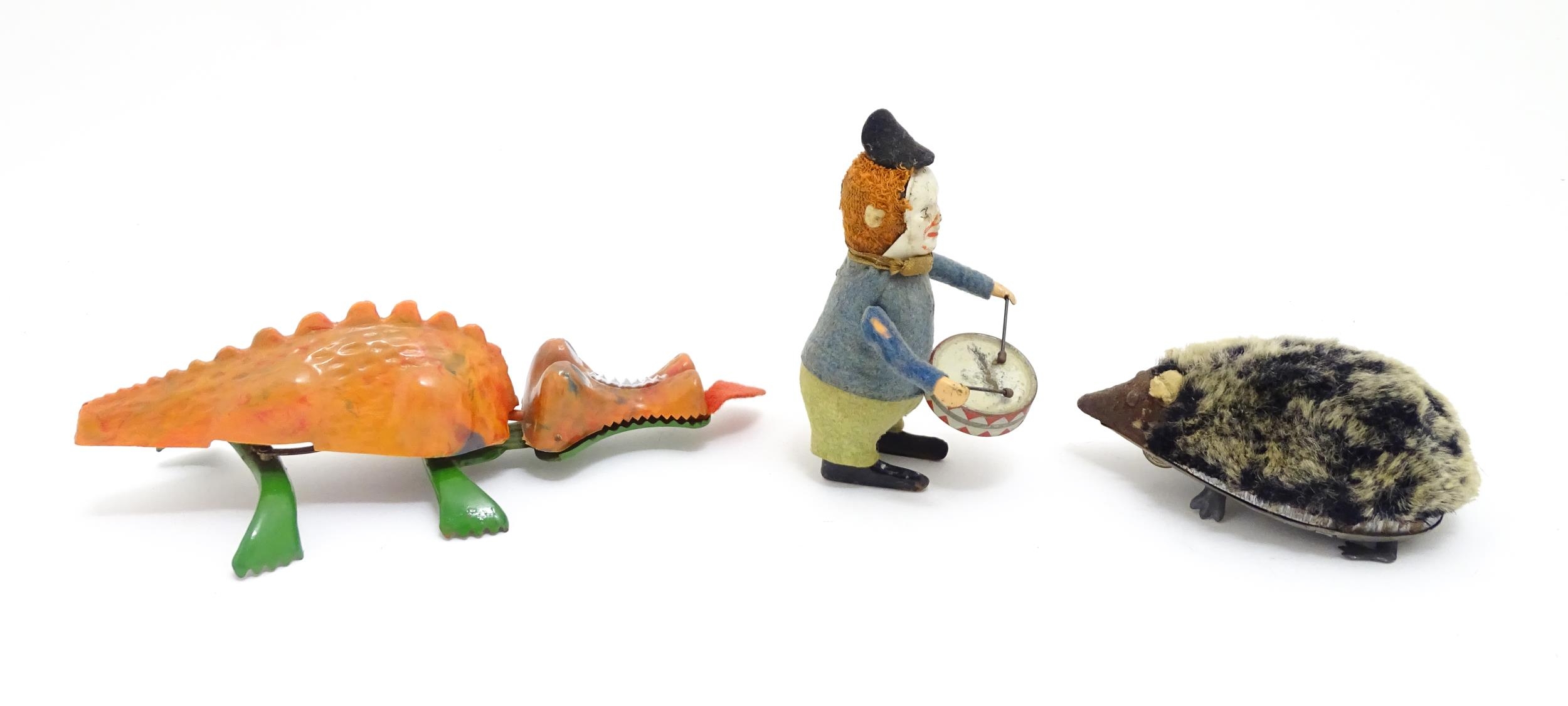 Toys: Three 20thC clockwork / wind up toys comprising a Schuco model of a clown playing the drum, - Bild 3 aus 10