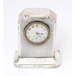 WWII RAF interest : A silver cased mantle clock with engine turned decoration and inscription to '