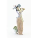 A Lladro figure titled Paris in Bloom, model no. 6280. With box. Approx. 12" high Please Note - we