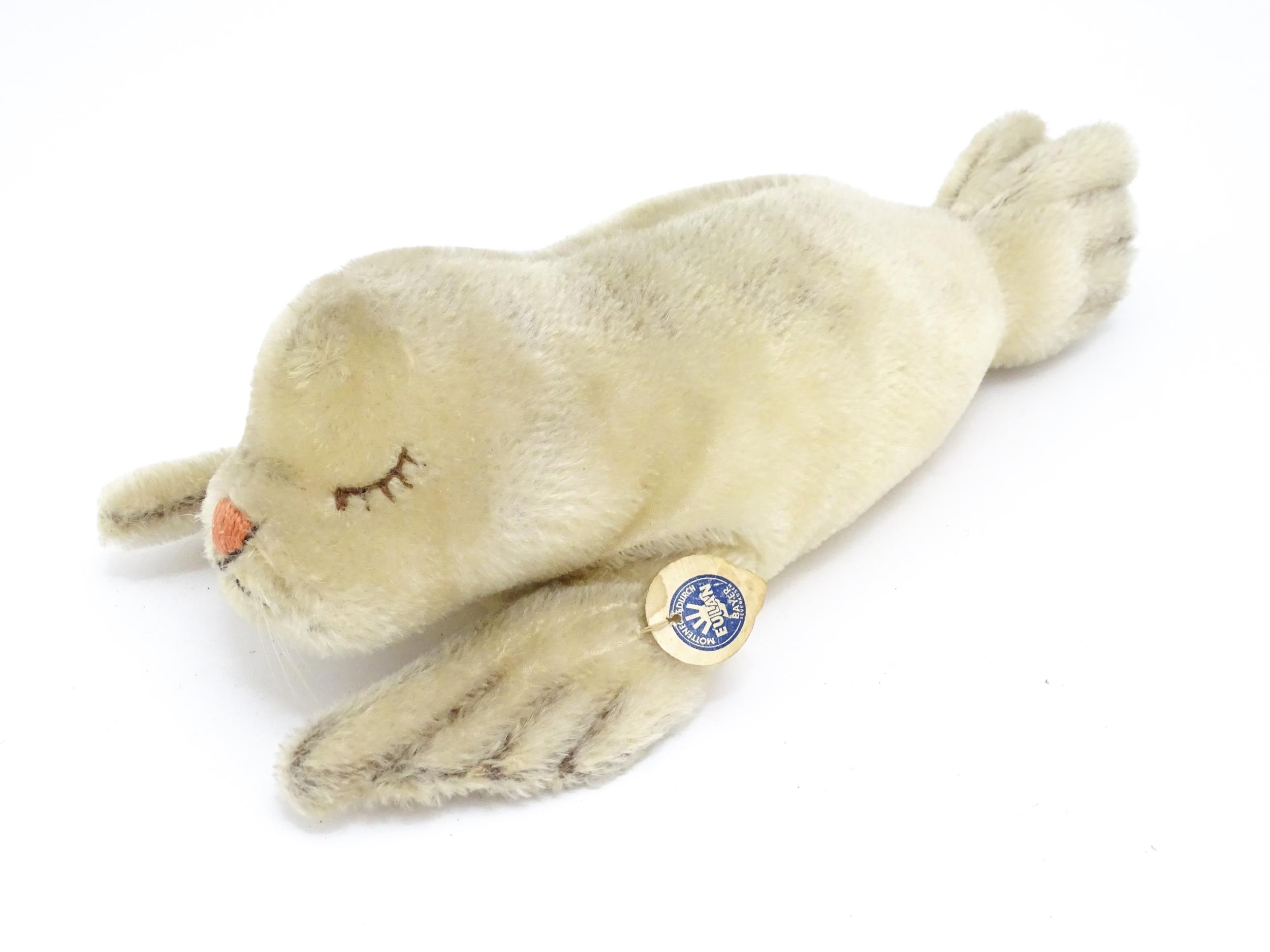 Toy: A 20thC Steiff mohair soft toy modelled as a sleeping seal - Floppy Robby, with stitched