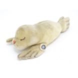 Toy: A 20thC Steiff mohair soft toy modelled as a sleeping seal - Floppy Robby, with stitched