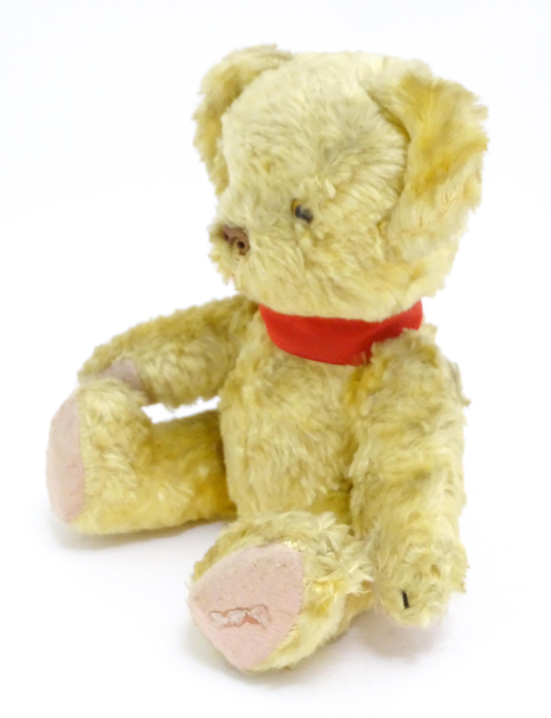 Toy: A 20thC plush teddy bear with scrolled nose, pad paws and articulated limbs. Approx. 11" long - Bild 3 aus 8