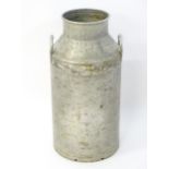 A vintage 10 gallon aluminium milk churn marked 'Whetstone N20' . Approx 28" high Please Note - we