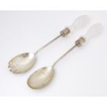 A Victorian pair of silver salad servers with cut glass handles. Hallmarked London 1897 maker Army &