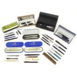 A large quantity of 20thC pens, including cased examples by Messenger, Cross and Hugo Boss and a set