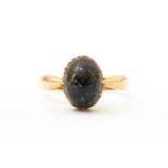 A 9ct gold ring set with black opal, hallmarked Birmingham 1938, maker J. M. Ring size approx. N
