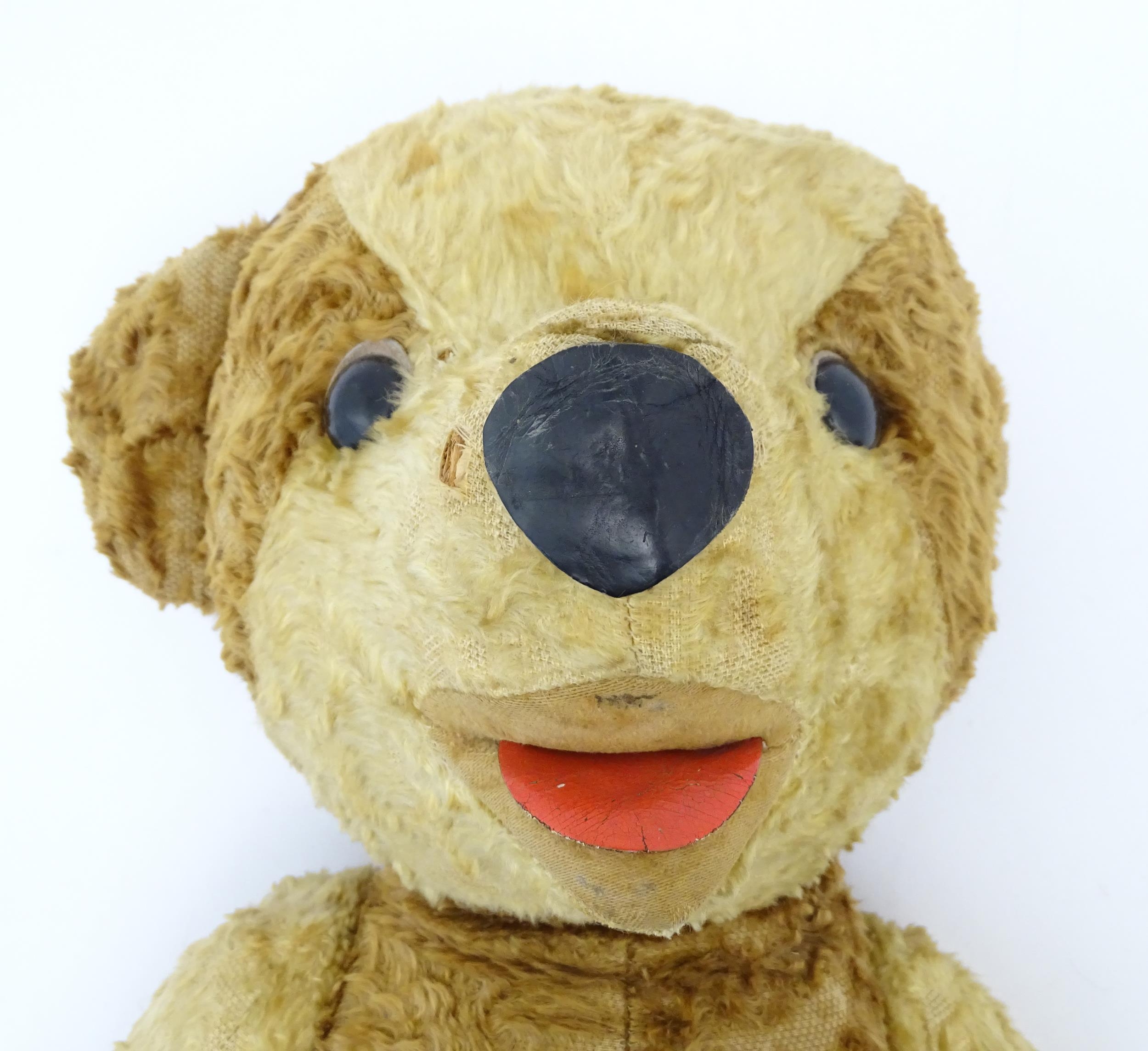 Toy: A 20thC straw filled teddy bear with leather tongue and articulated limbs. Approx. 22 1/2" - Bild 5 aus 7