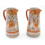 A pair of Japanese Kutani jugs decorated with a crowd of scholars. Character marks under. Approx. 10