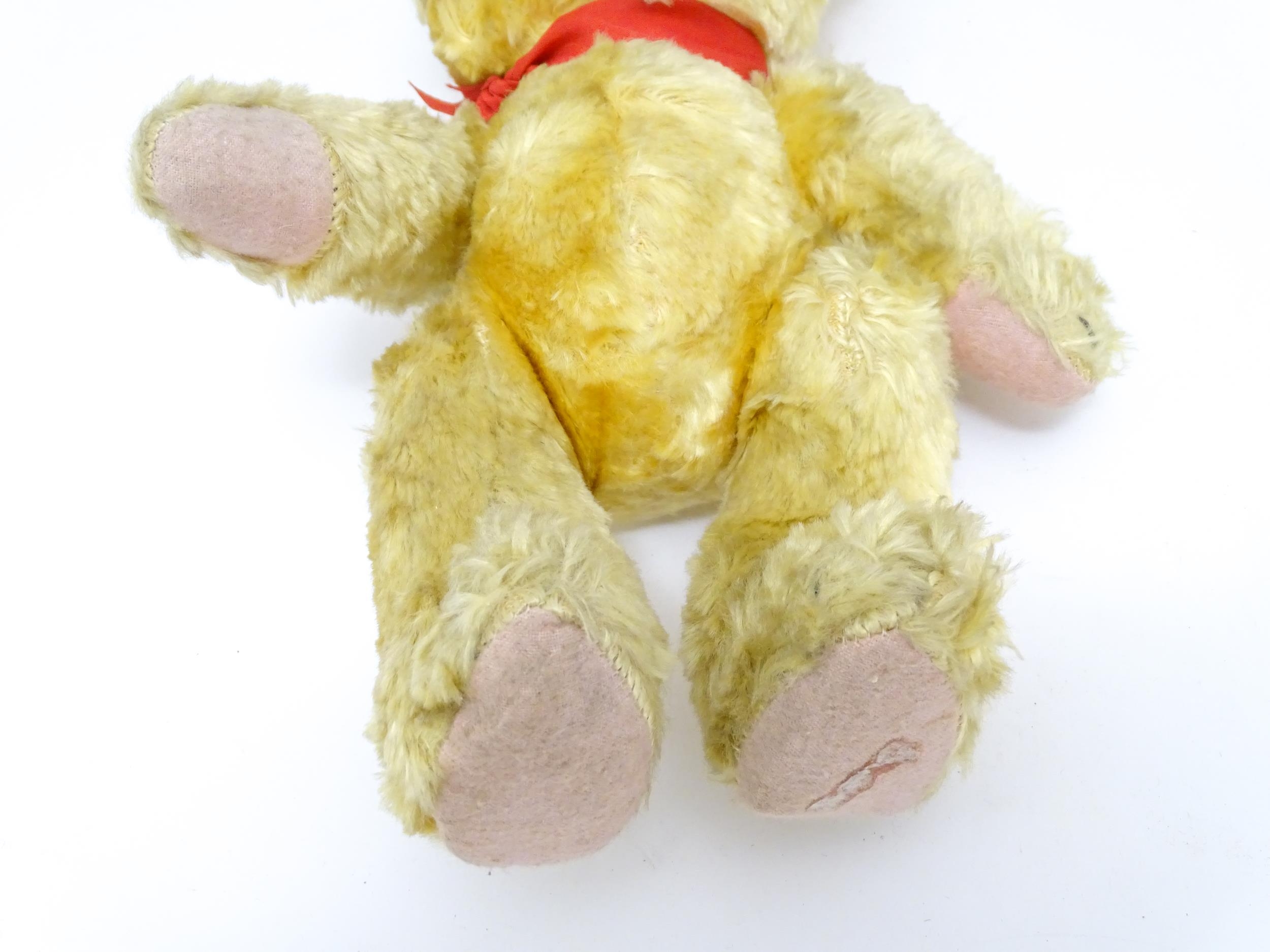 Toy: A 20thC plush teddy bear with scrolled nose, pad paws and articulated limbs. Approx. 11" long - Bild 7 aus 8