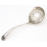 A silver sifting spoon hallmarked Sheffield 1973 maker Cooper Brothers & Sons Ltd. Approx. 4 1/2"