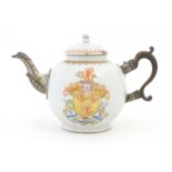 A Chinese Export teapot with silver plate spout, decorated with an armorial depicting rampant