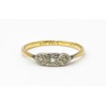 A 9ct gold ring with palladium set diamonds to top in an Art deco setting. Ring size approx. O