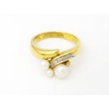 An 18ct gold ring set with diamonds and pearls. Ring size approx. N 1/2 Please Note - we do not make