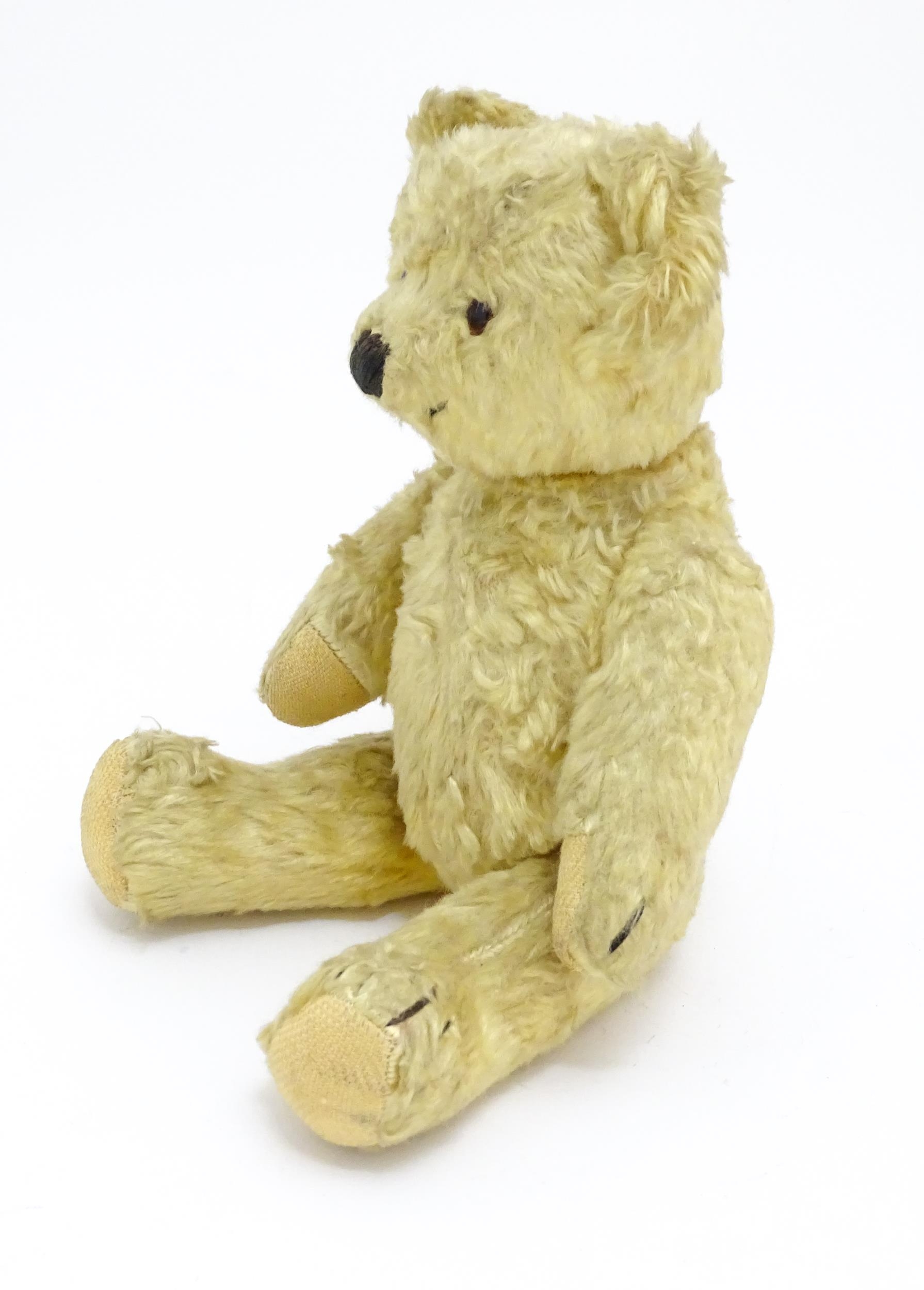 Toy: A 20thC straw filled teddy bear with stitched nose, mouth, and claws, pad paws and - Bild 3 aus 9
