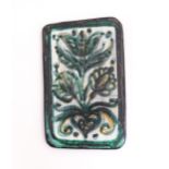 A studio pottery tile by Burkart Handarbeit, with floral and foliate detail. Signed to reverse.