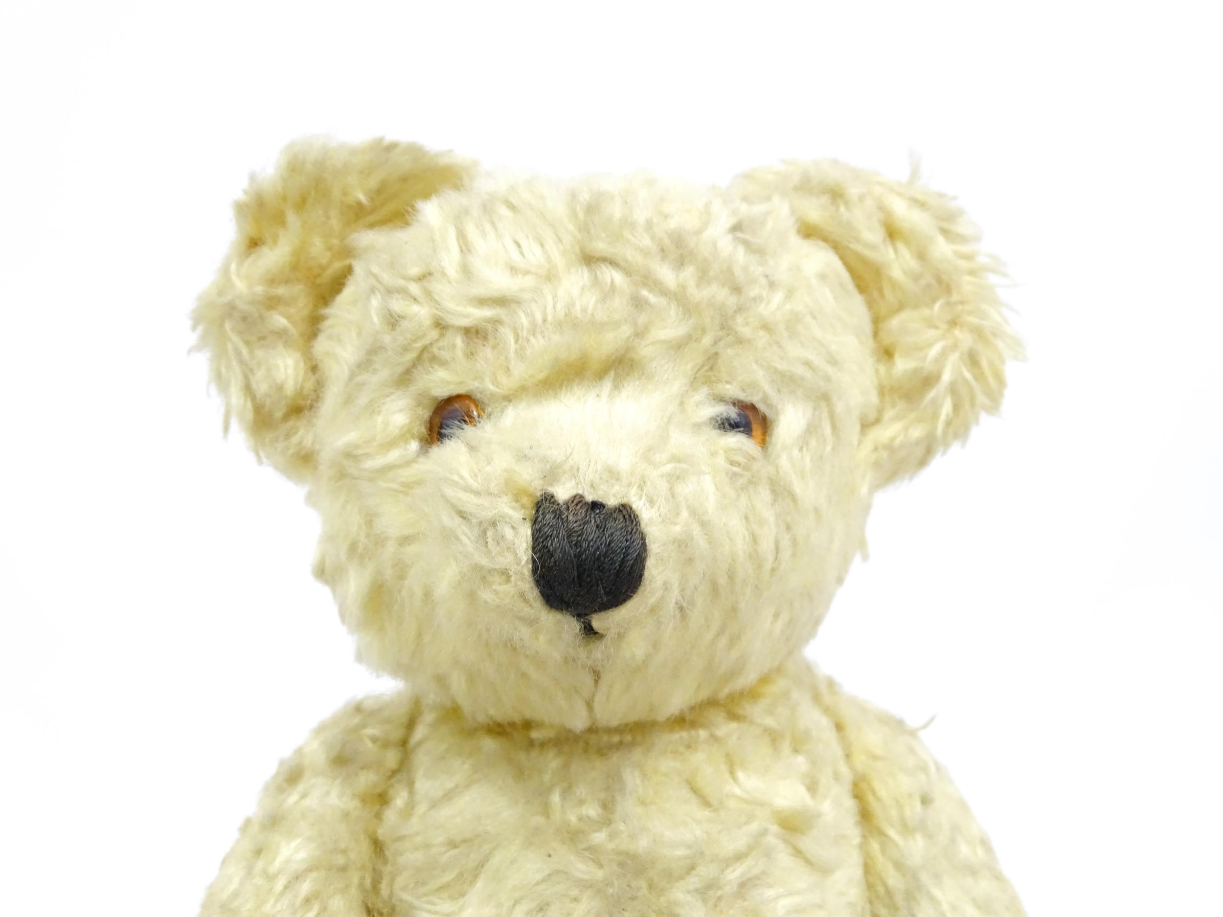 Toy: A 20thC straw filled teddy bear with stitched nose, mouth, and claws, pad paws and - Bild 4 aus 9