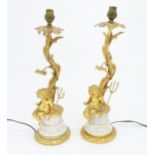 A pair of table amps with cast and gilded cherub detail. Approx 19" high Please Note - we do not