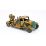 Toys: An early 20thC tin plate clockwork military vehicle with camouflage detail, two seated