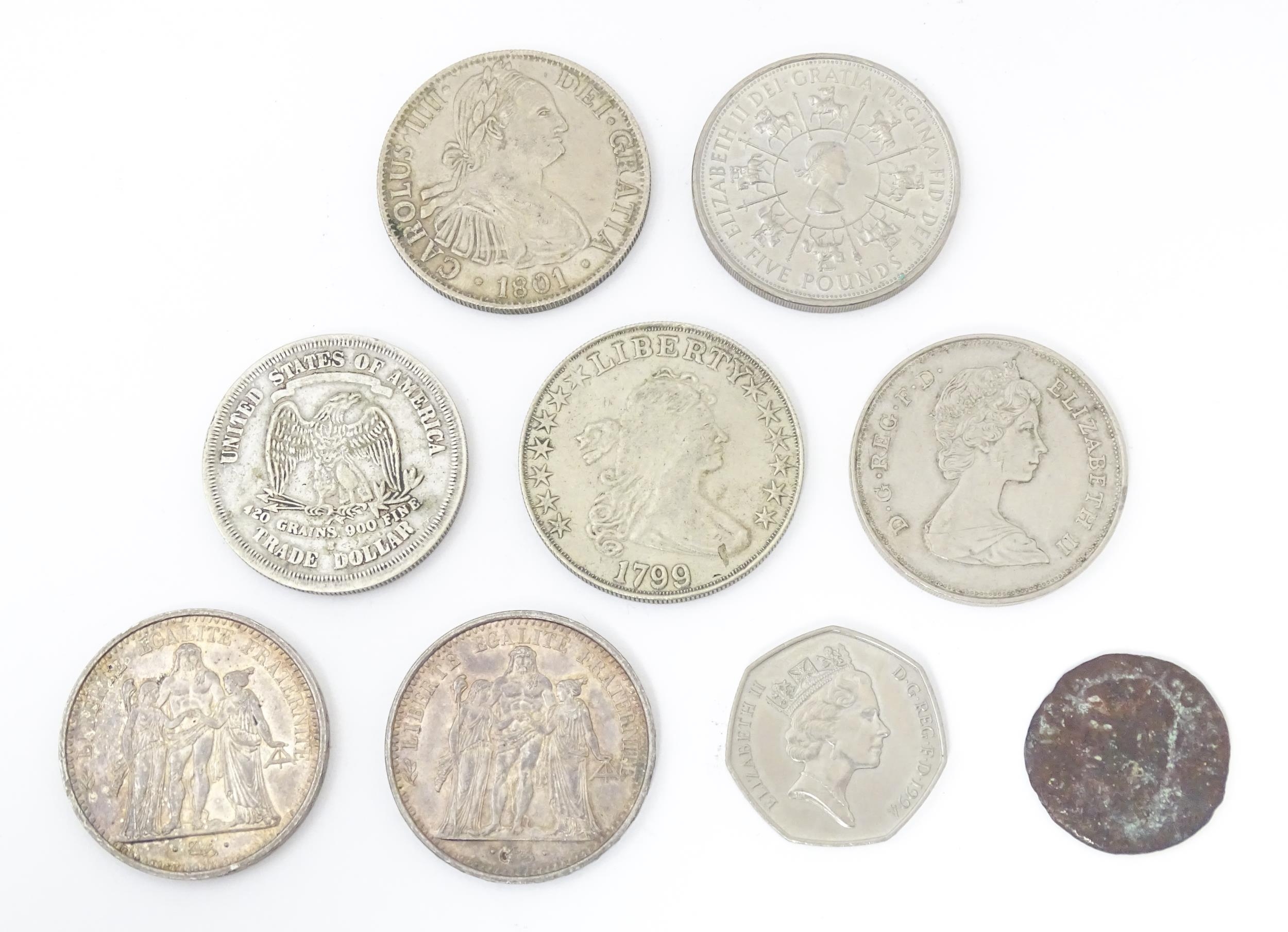 Nine assorted coins / commemorative coins to include an old bronze coin the reverse with a figure