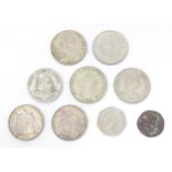 Nine assorted coins / commemorative coins to include an old bronze coin the reverse with a figure