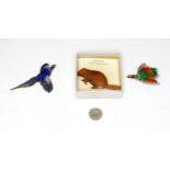 Three vintage brooches comprising one formed as a pheasant with enamel decoration, one of feather