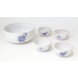 A Gale serving bowl with hand painted blue shield decoration and four soup bowls with similar