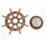 A late 20thC display ships wheel, together with an oak cased aneroid barometer. The largest approx