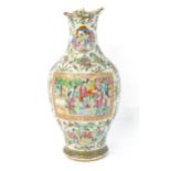 A Chinese famille rose vase decorated with figures, flowers, scrolls, butterflies, etc. Approx. 17