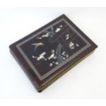 A Japanese photograph album with lacquered boards, the cover decorated with inlaid mother of pearl