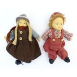 Toys: Two Scandinavian / Norwegian dolls with bisque heads, the girl with a knitted hat, scarf and